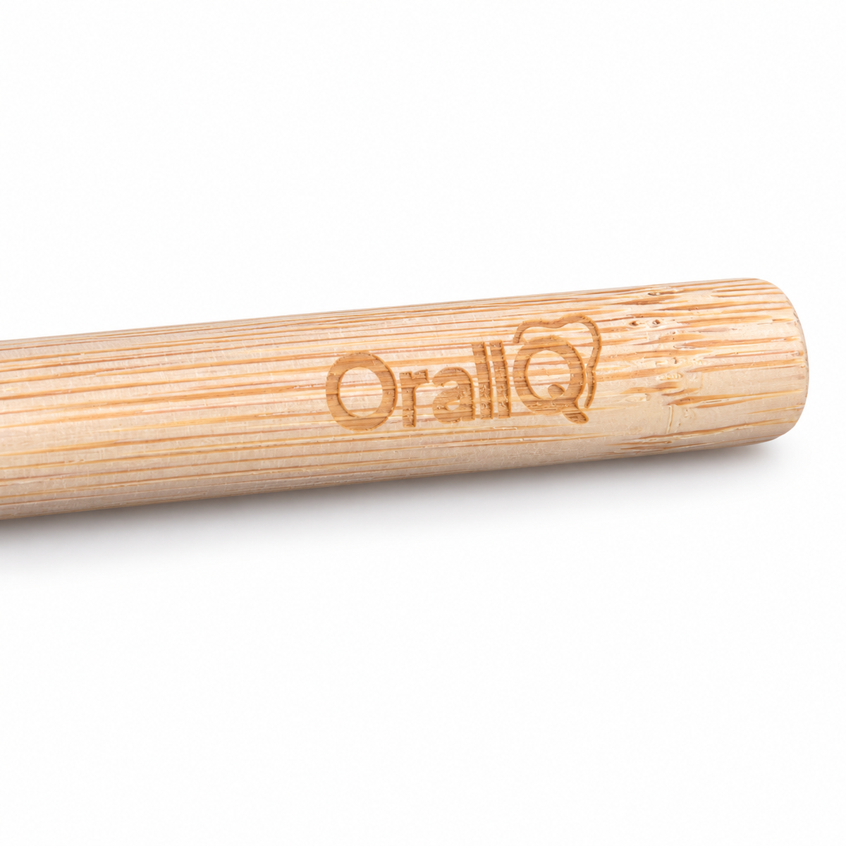 OralIQ Bamboo Nano Extra-Soft Toothbrush — engraved handle detail on white