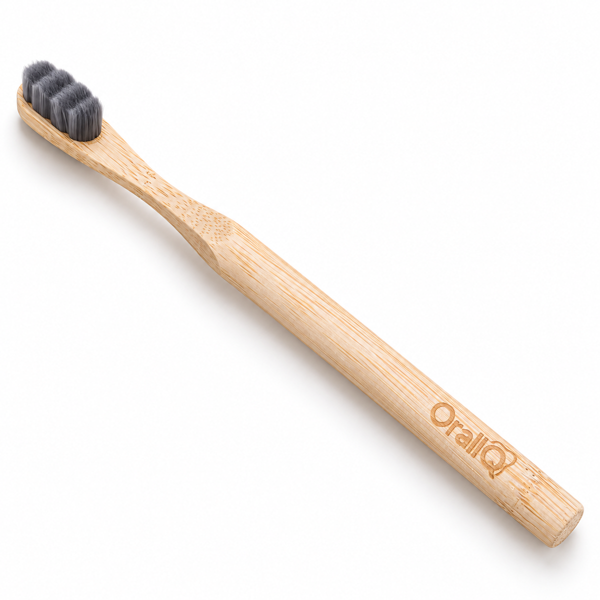 OralIQ bamboo nano toothbrush with its engraved handle facing the camera