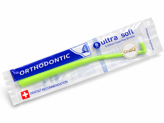 OralIQ Orthodontic Interspace Tuft Brush — packaging view on white